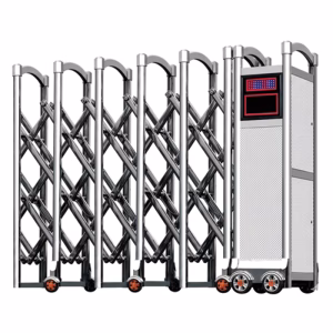 VARITO VR-J1715 stainless steel automatic retractable gate installed at a commercial warehouse entrance, featuring motorized wheels and a digital display.